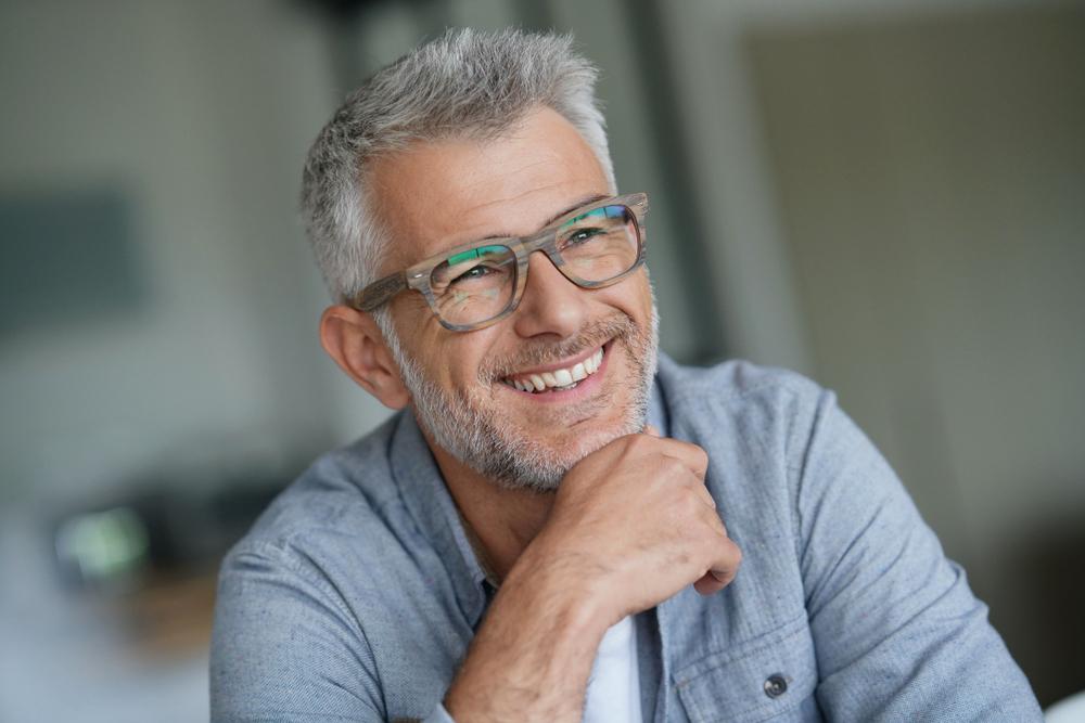 older man smiling.